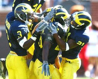 Julius Curry (26), Jeremy LeSueur (21), and CB Marlin Jackson (3)