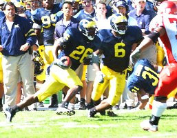 Julius Curry (26), Victor Hobson (6), Zia Combs (31), and Brady Hoke