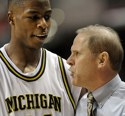 DeShawn Sims (34) and John Beilein