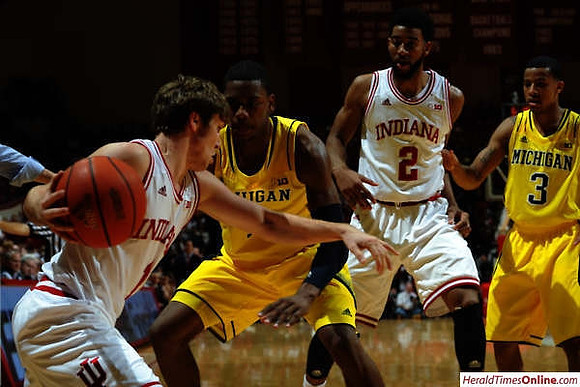 Glenn Robinson III (1) and Trey Burke (3)
