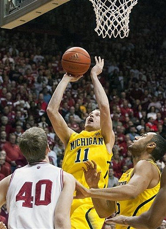 Nik Stauskas (11) and Jon Horford (15)