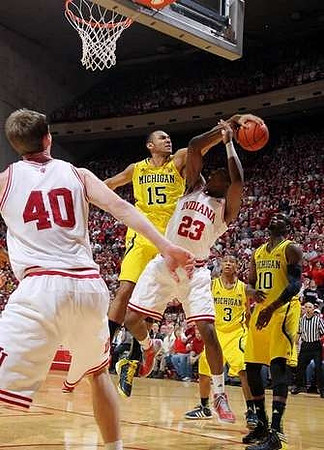 Jon Horford (15) , Trey Burke (3), and Tim Hardaway Jr. (10)
