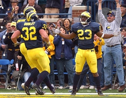 Chris Perry (23), Braylon Edwards (1), and Kevin Dudley (32)