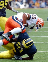 Jeremy LeSueur (21) and Pierre Woods (99)