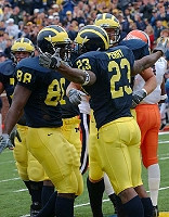 Chris Perry (23) and Tim Massaquoi (88)