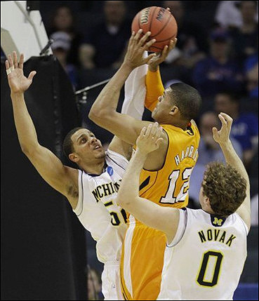 Zack Novak (0) and Jordan Morgan (52)