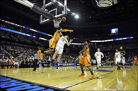 Matt Vogrich (13), Evan Smotrycz (23), and Darius Morris (4)