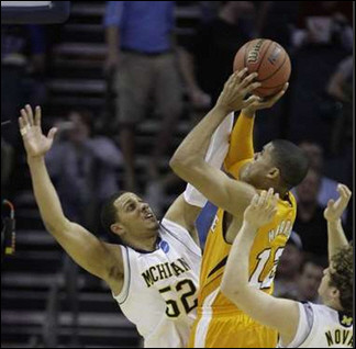 Jordan Morgan (52) and Zack Novak (0)