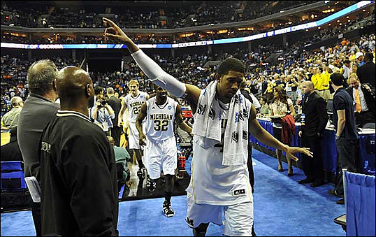 Darius Morris (4), Corey Person (32), and Blake McLimans (22)