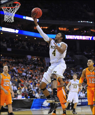 Darius Morris (4) and Matt Vogrich (13)