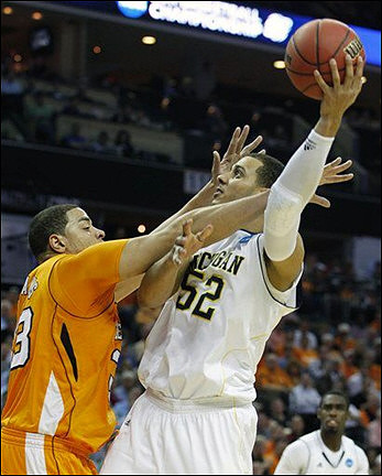 Jordan Morgan (52) and Tim Hardaway Jr. (10)
