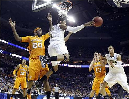Darius Morris (4) and Jordan Morgan (52)