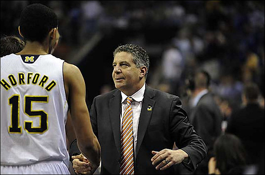 Jon Horford (15) and Bruce Pearl