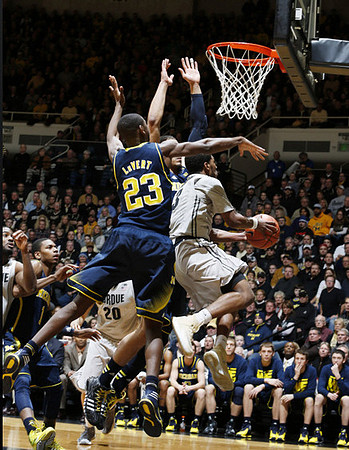 Glenn Robinson III (1) and Caris LeVert (23)