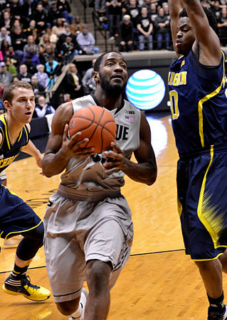 Nik Stauskas (11) and Derrick Walton Jr. (10)