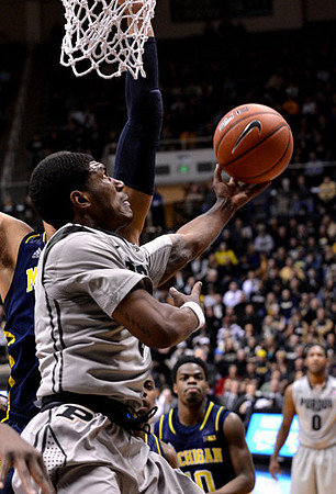 Jordan Morgan (52) and Derrick Walton Jr. (10)