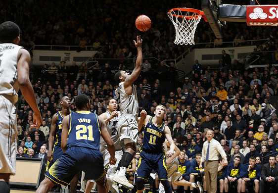 Zak Irvin (21), Caris LeVert (23), Nik Stauskas (11), and John Beilein
