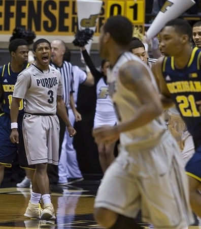 Derrick Walton Jr. (10) and Zak Irvin (21)