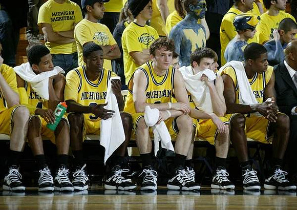 Darius Morris (4), Manny Harris (3), Zack Novak (0), Stu Douglass (1), and DeShawn Sims (34)
