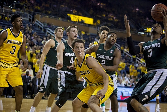 Kameron Chatman (3), Andrew Dakich (11), and D.J. Wilson (5)