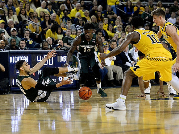 Derrick Walton Jr. (10) and Moritz Wagner (13)