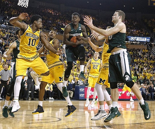 Derrick Walton Jr. (10), Zak Irvin (21), Duncan Robinson (22), and Mark Donnal (34)