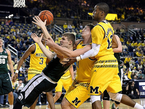 Kameron Chatman (3), Andrew Dakich (11), and Muhammad-Ali Abdur-Rahkman (12)