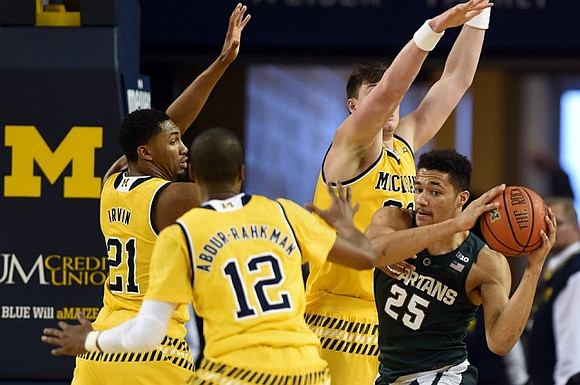 Zak Irvin (21), Muhammad-Ali Abdur-Rahkman (12), and Ricky Doyle (32)