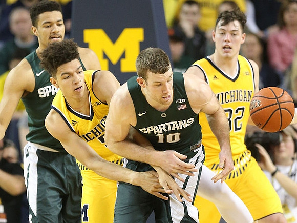 D.J. Wilson (5) and Ricky Doyle (32)