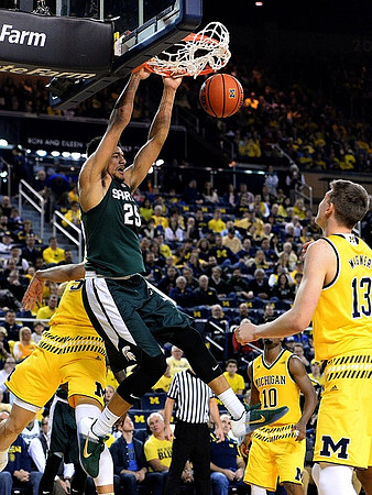 Derrick Walton Jr. (10) and Moritz Wagner (13)