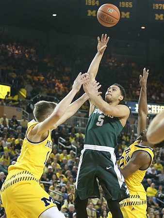 Moritz Wagner (13) and Derrick Walton Jr. (10)