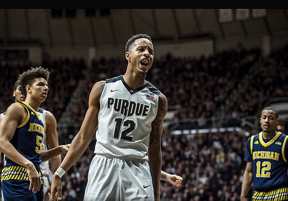 D.J. Wilson (5) and Muhammad-Ali Abdur-Rahkman (12)