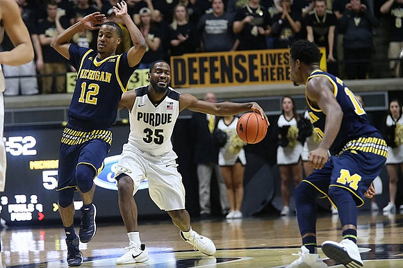 Muhammad-Ali Abdur-Rahkman (12) and Derrick Walton Jr. (10)