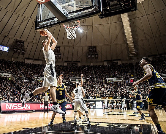 D.J. Wilson (5), Muhammad-Ali Abdur-Rahkman (12), and Aubrey Dawkins (24)