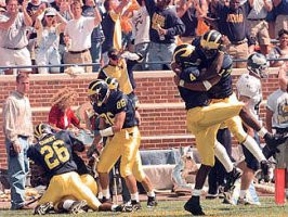 Marquise Walker (4), Larry Foote (17), and Julius Curry (26)