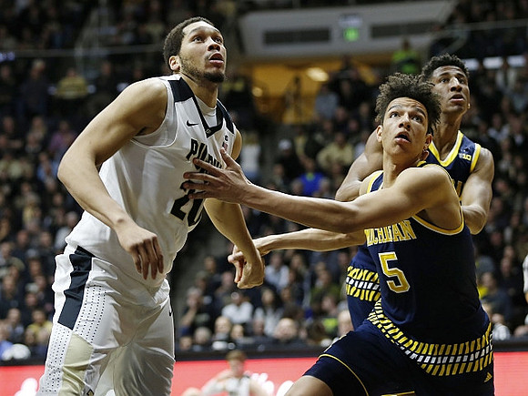 D.J. Wilson (5) and Aubrey Dawkins (24)
