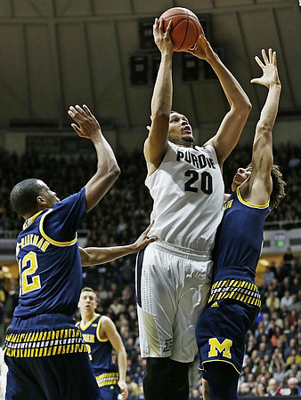 Muhammad-Ali Abdur-Rahkman (12) and D.J. Wilson (5)