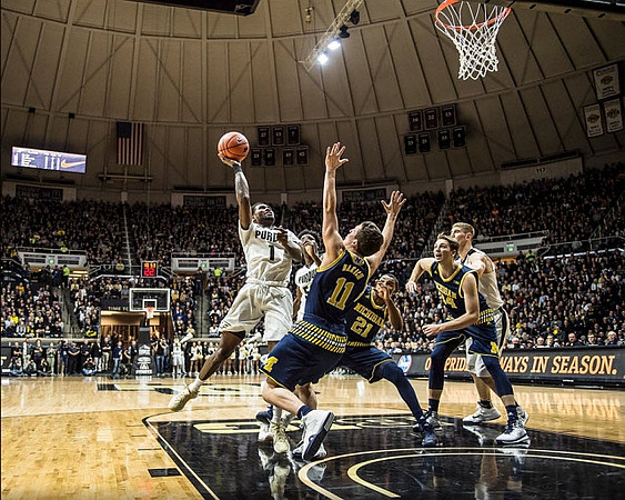 Andrew Dakich (11), Zak Irvin (21), and Mark Donnal (34)