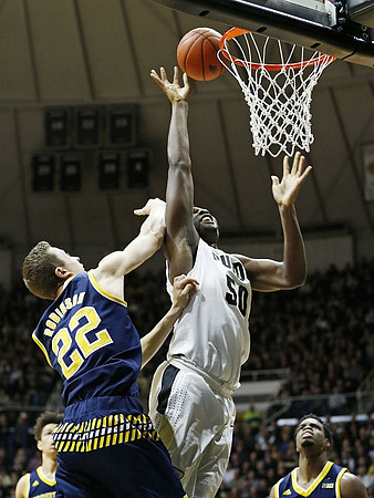 D.J. Wilson (5), Duncan Robinson (22), and Derrick Walton Jr. (10)