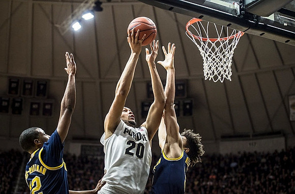Muhammad-Ali Abdur-Rahkman (12) and D.J. Wilson (5)