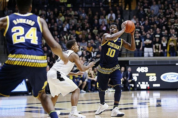 Aubrey Dawkins (24) and Derrick Walton Jr. (10)