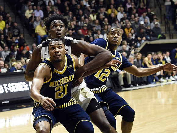 Zak Irvin (21) and Muhammad-Ali Abdur-Rahkman (12)