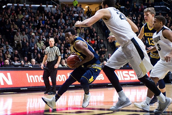 Derrick Walton Jr. (10) and Moritz Wagner (13)