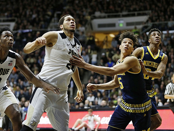 D.J. Wilson (5) and Aubrey Dawkins (24)