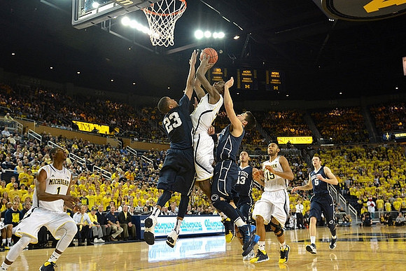 Glenn Robinson III (1), Caris LeVert (23), and Jon Horford (15)