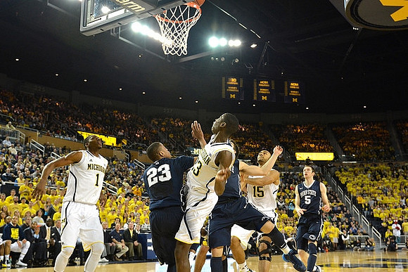 Glenn Robinson III (1), Caris LeVert (23), and Jon Horford (15)