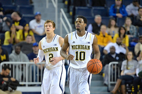 Spike Albrecht (2) and Derrick Walton Jr. (10)