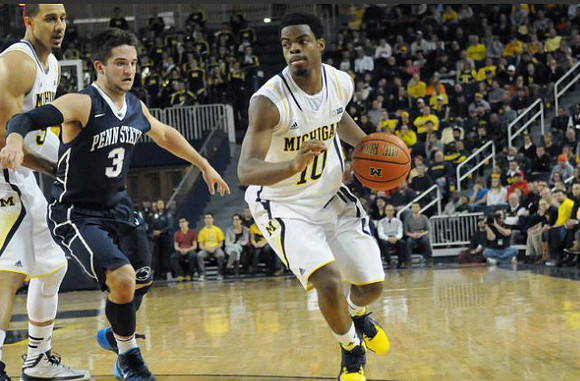 Jordan Morgan (52) and Derrick Walton Jr. (10)