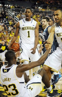Caris LeVert (23), Glenn Robinson III (1), and Jon Horford (15)