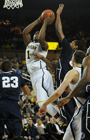 Glenn Robinson III (1) and Nik Stauskas (11)
